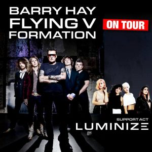 Barry Hay's Flying V formation in concert with support act Luminize